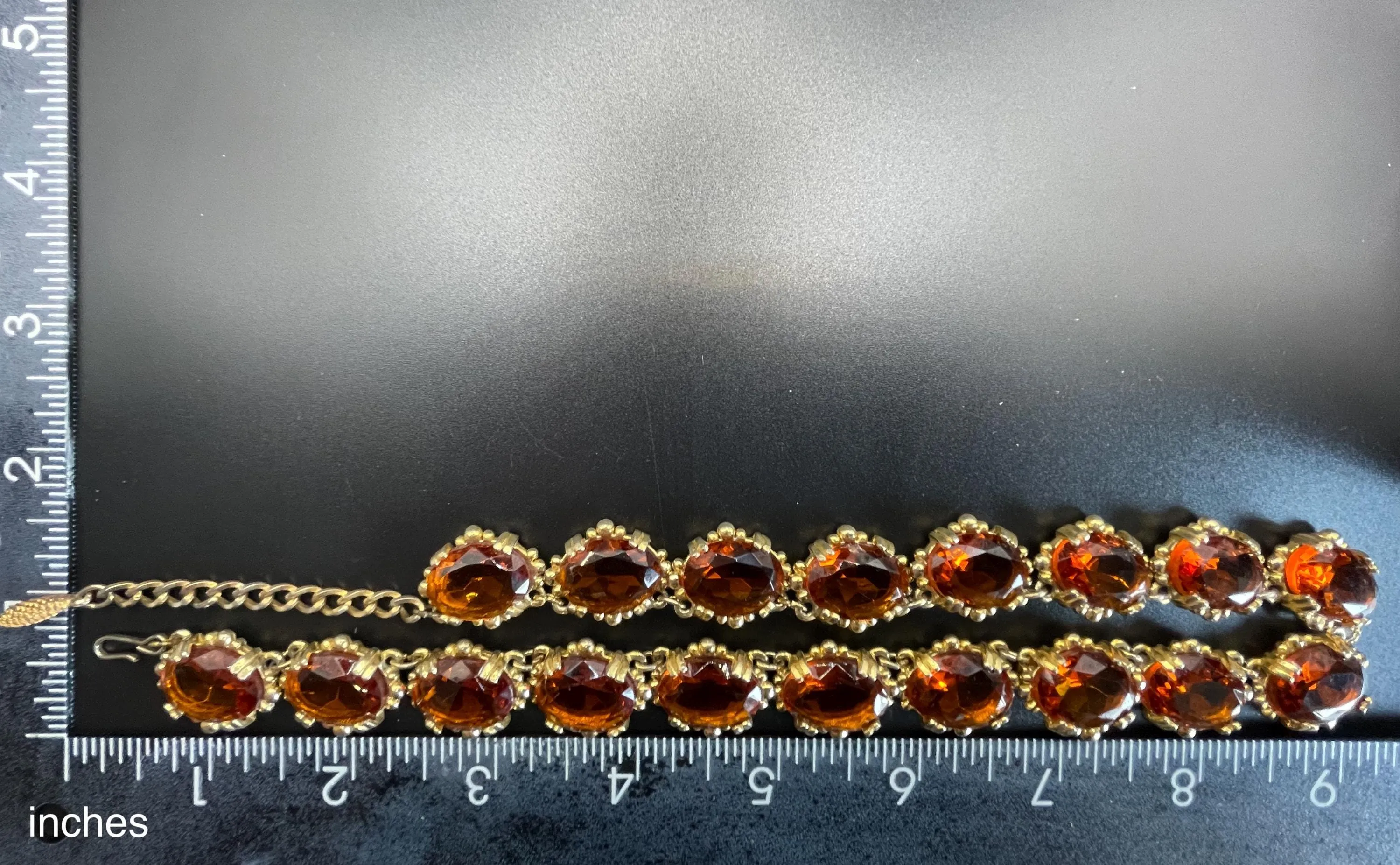 Vintage bright orange topaz / citrine yellow riviere necklace, made by Sphinx, bezel set, open-backed stones in ornate gold tone setting